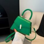 Emerald Twist Top Handle Mini Bag