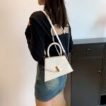 Emerald Twist Top Handle Mini Bag